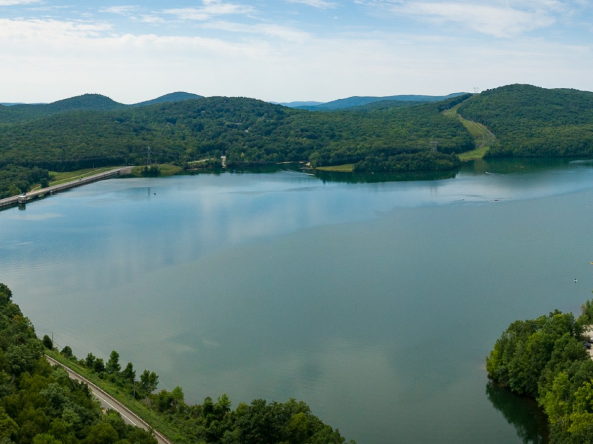 a body of water with a mountain in the background