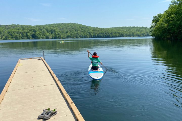 a person paddle boarding on shepherd lake
