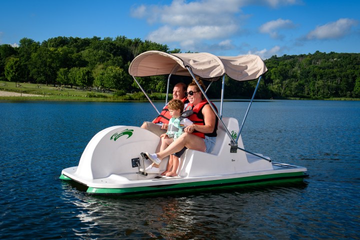 a small boat in a body of water