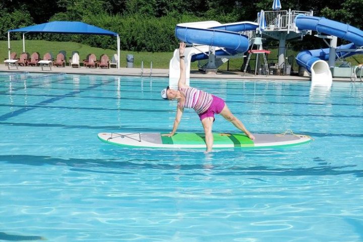 a blue frisbee in a pool of water